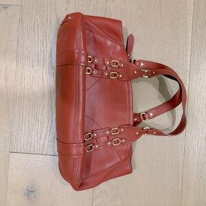 Coke Haan rust colored handbag